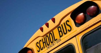 Semi avoids school bus, overturns Monday afternoon