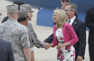 Dr. Jill Biden, wife of U.S. Vice President Joe Biden, shakes hands with U.S. 7th Air Force Commander Lt. Gen. Terrence J. O'Shaughnessy upon her arrival for a two-day visit, at Osan Air Base in Pyeongtaek, south of Seoul, South Korea, Saturday, July 18, 2015. (AP Photo/Lee Jin-man)