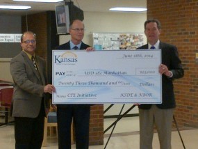 (from left to right) USD 383 School Board President, Curt Herrman; USD 383 Superintendent, Bob Shannon and Governor Sam Brownback