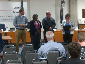 School Board President, Leah Fliter presents a few board members with the Honor Roll Level 1 achievement