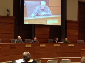 Law Board Chair John Matta on screen--photos by Cathy Dawes