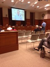 RCPD Captain Josh Kyle at podium and on screen