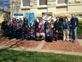 Volunteers and supporters of Sunflower CASA gathered at the pinwheel garden on Friday, April 3.