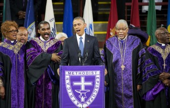President Barack Obama sings "Amazing Grace" during services honoring the life of Rev. Clementa Pinckney, Friday, June 26, 2015, at the College of Charleston TD Arena in Charleston, S.C.. Pinckney was one of the nine people killed in the shooting at Emanuel AME Church last week in Charleston. (AP Photo/David Goldman)