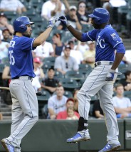 Kansas City Royals' Lorenzo Cain, right, celebrates with teammate Eric Hosmer after hitting a solo home run during the 13th inning of a baseball game against the Chicago White Sox, Saturday, July 18, 2015, in Chicago. The Royals won 7-6. (AP Photo/Nam Y. Huh)