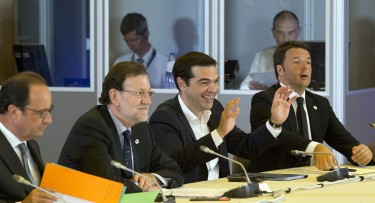 Greek Prime Minister Alexis Tsipras, second right, gestures while speaking during a round table meeting at an emergency summit of eurozone heads of state or government at the EU Council building in Brussels on Tuesday, July 7, 2015. Greek Prime Minister Alexis Tsipras on Tuesday will try to use a resounding referendum victory to eke out concessions from European creditors over a bailout for the crisis-ridden country. From left, French President Francois Hollande, Spanish Prime Minister Mariano Rajoy and Italian Prime Minister Matteo Renzi. (AP Photo/Michel Euler)