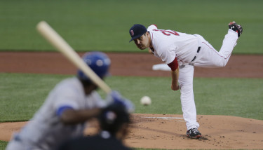 Boston Red Sox starting pitcher Wade Miley delivers against the Kansas City Royals during the first inning of a baseball game at Fenway Park in Boston, Thursday, Aug. 20, 2015. (AP Photo/Charles Krupa)