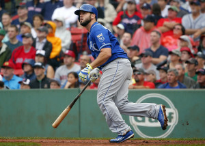Kansas City Royals' Mike Moustakas watches his home run against the Boston Red Sox during the sixth inning of a baseball game at Fenway Park in Boston, Sunday, Aug. 23, 2015. (AP Photo/Winslow Townson)