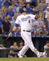 Kansas City Royals' Alex Gordon hits a sacrifice fly to score Eric Hosmer during the second inning of a baseball game against the Detroit Tigers Tuesday, Sept. 1, 2015, in Kansas City, Mo. (AP Photo/Charlie Riedel)
