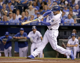Kansas City Royals' Eric Hosmer hits a three-run double during the first inning of a baseball game against the Minnesota Twins Tuesday, Sept. 8, 2015, in Kansas City, Mo. (AP Photo/Charlie Riedel)