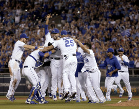 Kansas City Royals celebrate after a baseball game against the Seattle Mariners on Thursday, Sept. 24, 2015, in Kansas City, Mo. The Royals won 10-4 and clinched the AL Central. (AP Photo/Charlie Riedel)