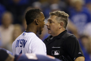 Kansas City Royals left fielder Jarrod Dyson (1) and umpire Greg Gibson, right, during a baseball game against the Minnesota Twins at Kauffman Stadium in Kansas City, Mo., Wednesday, Sept. 9, 2015. (AP Photo/Orlin Wagner)