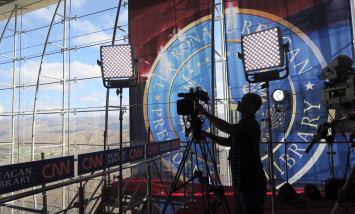 A technician adjusts a television camera before the start of the CNN Republican presidential debates at the Ronald Reagan Presidential Library and Museum Wednesday, Sept. 16, 2015 in Simi Valley, Calif. (AP Photo/Tom Stathis)