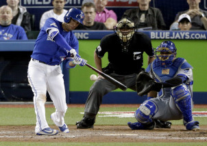 Toronto Blue Jays' Ryan Goins hits a home run against the Kansas City Royals during the fifth inning in Game 3 of baseball's American League Championship Series on Monday, Oct. 19, 2015, in Toronto. (AP Photo/Charlie Riedel)