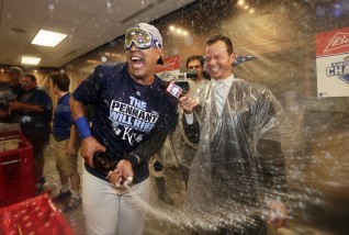 Kansas City Royals celebrates catcher Salvador Perez their 4-3 win against the Toronto Blue Jays in Game 6 of baseball's American League Championship Series on Friday, Oct. 23, 2015, in Kansas City, Mo. (AP Photo/Charlie Riedel)