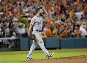 Kansas City Royals pitcher Danny Duffy walks back to the mound after giving up a home run to Houston Astros' Chris Carter during the seventh inning in Game 3 of baseball's American League Division Series Sunday, Oct. 11, 2015, in Houston. (AP Photo/Pat Sullivan)