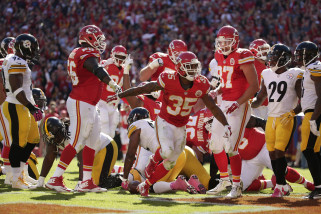 Kansas City Chiefs running back Charcandrick West (35) celebrates after scoring a touchdown during the second half of an NFL football game against the Pittsburgh Steelers in Kansas City, Mo., Sunday, Oct. 25, 2015. (AP Photo/Charlie Riedel)