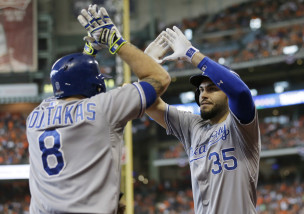 Kansas City Royals' Eric Hosmer (35) celebrates with teammate Mike Moustakas (8) after his two-run home run in the ninth inning during Game 4 of baseball's American League Division Series against the Houston Astros, Monday, Oct. 12, 2015, in Houston. Kansas City won 9-6. (AP Photo/David J. Phillip)