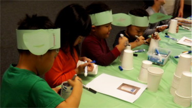 Crafts, they are constructing. Kids put together Yoda ears Saturday afternoon at the Manhattan Public Library for "Star Wars Reads Day."