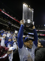 Kansas City Royals' Jarrod Dyson holds the World Series trophy after Game 5 of the Major League Baseball World Series against the New York Mets Monday, Nov. 2, 2015, in New York. The Royals won 7-2 to win the series. (AP Photo/Matt Slocum)