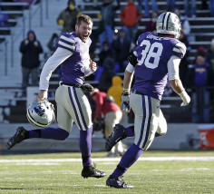 Kansas State place kicker Jack Cantele, left, celebrates with fullback Winston Dimel (38) after kicking a 42-yard field goal with seven seconds on the clock to win an NCAA college football game against Iowa State Saturday, Nov. 21, 2015, in Manhattan, Kan. Kansas State won 38-35. (AP Photo/Charlie Riedel)