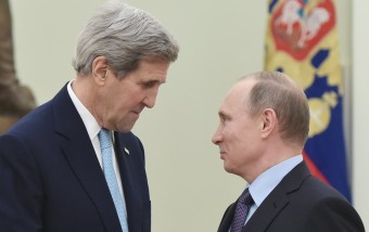 US Secretary of State John Kerry, left, speaks with Russia's President Vladimir Putin during a meeting at the Kremlin in Moscow Tuesday, Dec. 15, 2015. The United States and Russia need to find "common ground" to end Syria's civil war and restore stability in eastern Ukraine, U.S. Secretary of State John Kerry said Tuesday.  (Mandel Ngan/Pool Image via AP)