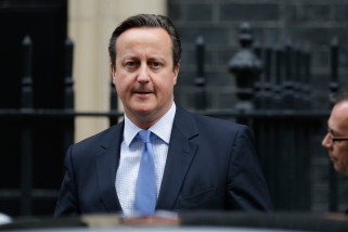 British Prime Minister David Cameron leaves 10, Downing Street in London, to go to the Houses of Parliament for a debate and vote on launching airstrikes against Islamic State extremists inside Syria, Wednesday, Dec. 2, 2015. The vote expected Wednesday evening would authorize bombing inside Syria. Britain has been participating in U.S.-led coalition attacks against IS positions in Iraq only. (AP Photo/Matt Dunham)