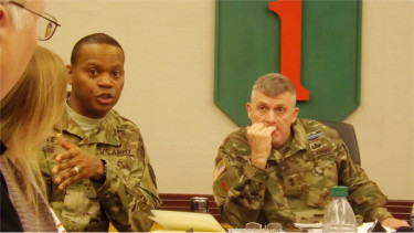 Fort Riley Garrison Commander Col. Andrew Cole answers a question from the media Friday morning inside the 1st Infantry Division Headquarters. Maj. Gen. Wayne W. Grigsby, the commanding general of Fort Riley, sits right.