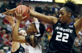 Baylor forward Nina Davis (13) attempts a shot as Kansas State forward Breanna Lewis (22) and guard Shaelyn Martin, background, defend during the first half of an NCAA college basketball game in the quarterfinals of the Big 12 Conference tournament, Saturday, March 7, 2015, in Dallas. Baylor won 82-70. (AP Photo/Brandon Wade)