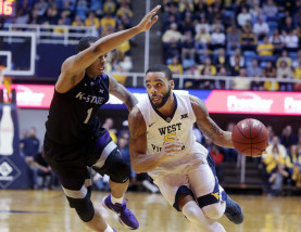 Kansas State guard Carlbe Ervin II (1) tries to stop West Virginia guard Jaysean Paige (5) during the second half of an NCAA college basketball game, Tuesday, Jan, 26, 2016, in Morgantown, W.Va. (AP Photo/Raymond Thompson)