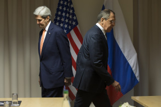 U.S. Secretary of State John Kerry, left, and Russian Foreign Minister Sergey Lavrov walk to their seats for a meeting about Syria, in Zurich, Switzerland, on Wednesday, Jan. 20, 2016, before Kerry was to attend the World Economic Forum in Davos. Kerrys trip is expected to last nine days and to encompass stops in Switzerland, Saudi Arabia, Laos, Cambodia, and China. (AP Photo/Jacquelyn Martin, Pool)