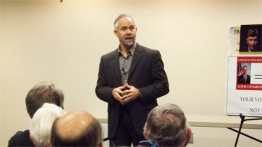 U.S. Congressman Tim Huelskamp speaks to the audience in the Manhattan Public Library. Huelskamp held a town hall meeting in the Little Apple on Jan. 19 -- his first town hall of 2016. (Staff photo by Brady Bauman)