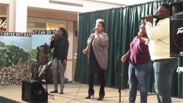 Members from the Mt. Zion Family Worship Center perform a song in the Manhattan Town Center Monday for the 32nd Annual Dr. Martin Luther King Jr. Celebration. 