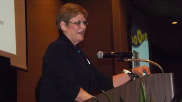 Jan Miller accepts the 2015 Lud Fiser Citizen of the Year Award Friday night during the Manhattan Area Chamber of Commerce's 91st Annual Meeting and Banquet inside the Manhattan Conference Center. (Staff photos by Brady Bauman)