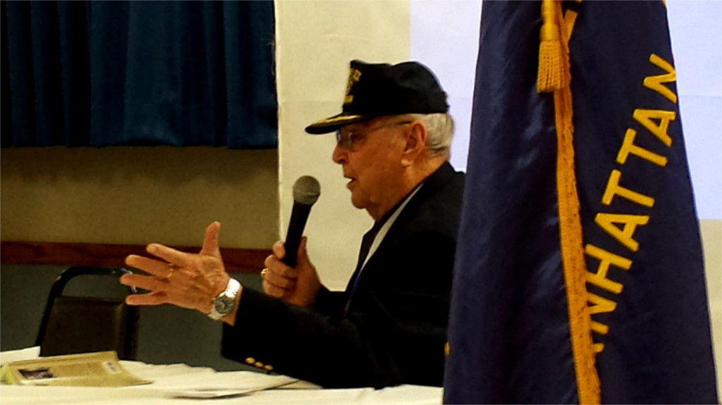 Manhattan resident and World War II veteran Jim Sharp speaks to observers about his experiences as one of the “select” senior security personnel for the Nuremberg tribunals in 1945.