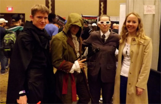 Costumed friends stop for a photo op on the main floor of the Little Apple Comic Con.