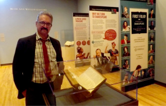 Don Hedrick, a professor in KSU's Department of English, stands by Shakespeare's "First Folio" on display at K-State's Beach Museum of Art.