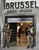 Police secures the central station in Brussels, Wednesday, March 23, 2016. Bombs exploded yesterday at the Brussels airport and one of the city's metro stations Tuesday, killing and wounding scores of people, as a European capital was again locked down amid heightened security threats. (AP Photo/Martin Meissner)