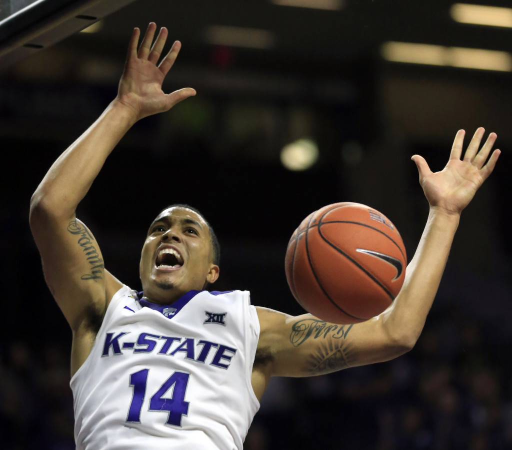 Kansas State guard Justin Edwards (14) celebrates a dunk during the second half of an NCAA college basketball game against Maryland Eastern Shore in Manhattan, Kan., Friday, Nov. 13, 2015. Kansas State defeated Maryland Eastern Shore 80-53. (AP Photo/Orlin Wagner)