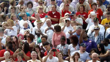 Participants in Sunday's Guinness World Records selfie tag themselves through their phones Sunday afternoon at Bishop Stadium in Manhattan.