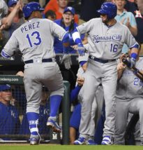Kansas City Royals' Salvador Perez (13) celebrates his two-run home run with Paul Orlando (16) in the eighth inning of a baseball game against the Houston Astros, Wednesday, April 13, 2016, in Houston. (AP Photo/Eric Christian Smith)