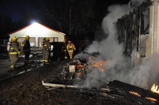 Crews attend to a house fire at ......