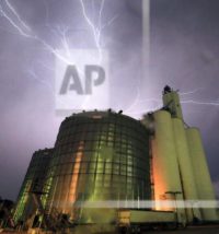 Lightning from a severe storm fills the sky behind a grain elevator in Belvue, Kan., Wednesday, May 25, 2016. The storm produced tornados near Chapman, Kan. (AP Photo/Orlin Wagner)