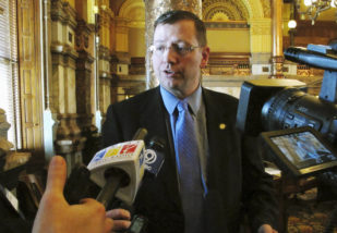 Kansas Senate Majority Leader Terry Bruce, R-Nickerson, speaks with reporters during a break in the chamber's session with lawmakers trying to decide whether to tackle a school funding bill, Wednesday, June 1, 2016, at the Statehouse in Topeka, Kan. The state Supreme Court has rejected some education funding changes made by lawmakers earlier in the year (AP Photo/John Hanna)