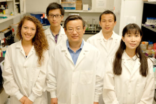 Weiping Zhang credits his team for the success in acquiring grants to support his research on E. coli-related vaccines. From left are Carolina Garcia, master's student in biomedical science; Jiachen Huan, master's student in biomedical science; Weiping Zhang, professor of microbiology; Qiangde Duan, postdoctoral fellow in diagnostic medicine and pathobiology; and Ti Lu, doctoral student in pathobiology. Not pictured are former postdoctoral fellows Rahul Nandre, Xiaosai Ruan and Mei Liu.