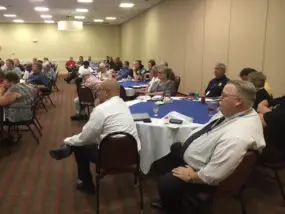 Photos by Bob Stamey: Riley County Emergency Management Director, Pat Collins, right, participating in state LEPC Conference