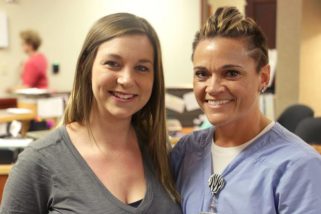 Jessi Erickson, RN, right, poses for a photo with her former patient, Carly Suther, after receiving the DAISY Award for exceptional nursing July 21.