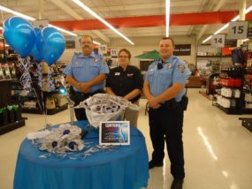 (Photo by Joyce Mermis: L to R- Deputy Chief of Police Paul Schliffke, Wamego Store Manager Brenda Schleif, Officer Zachary Mathies.)