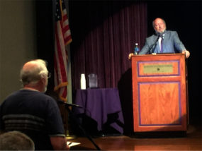 Jim Machor, left, voices his concern over the new state law which requires K-State to accommodate concealed handguns on campus. Moderator Fred Guzek, right, has served on the group of faculty implementing the new policy. (Staff photo by Andrew Shores)