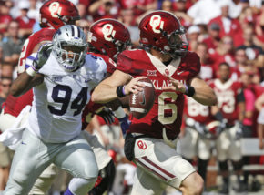 Oklahoma quarterback Baker Mayfield (6) is pursued by Kansas State defensive end C.J. Reese (94) in the second quarter of an NCAA college football game in Norman, Okla., Saturday, Oct. 15, 2016. (AP Photo/Sue Ogrocki)